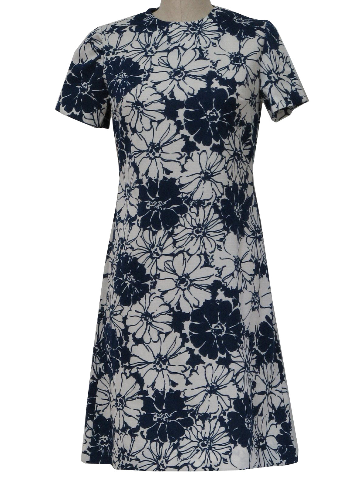 70s -Pretty Pam- Womens navy blue and white floral print short sleeve mid length polyester double knit dress with jewel neckline and back neck zipper.