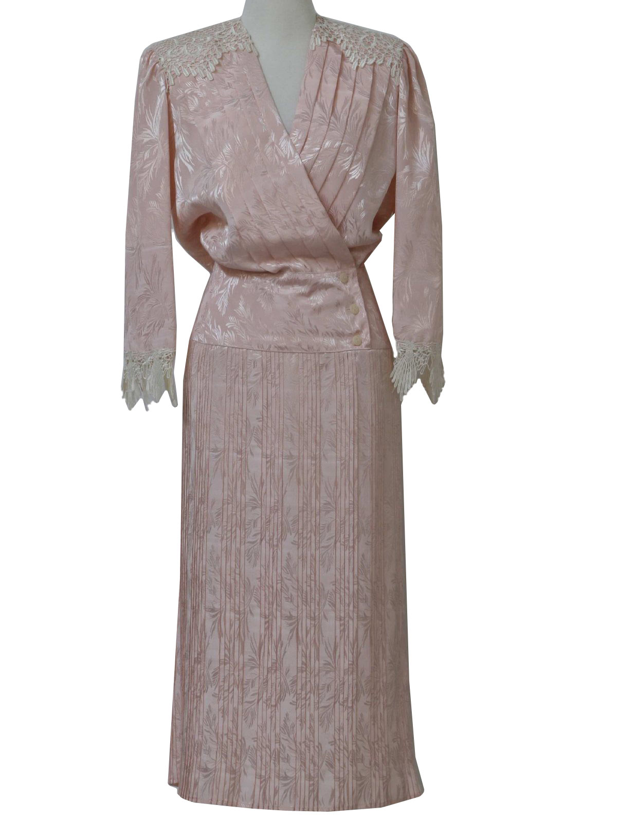 80s -Nilani- Womens pink floral jacquard print polyester shin length totally 80s dress with cross over v-neckline, thick shoulder pads, lace trimmed yoke, pinch pleated bodice, three off center button accenting at side waistline, tight accordion pleated skirt and box cut hem.