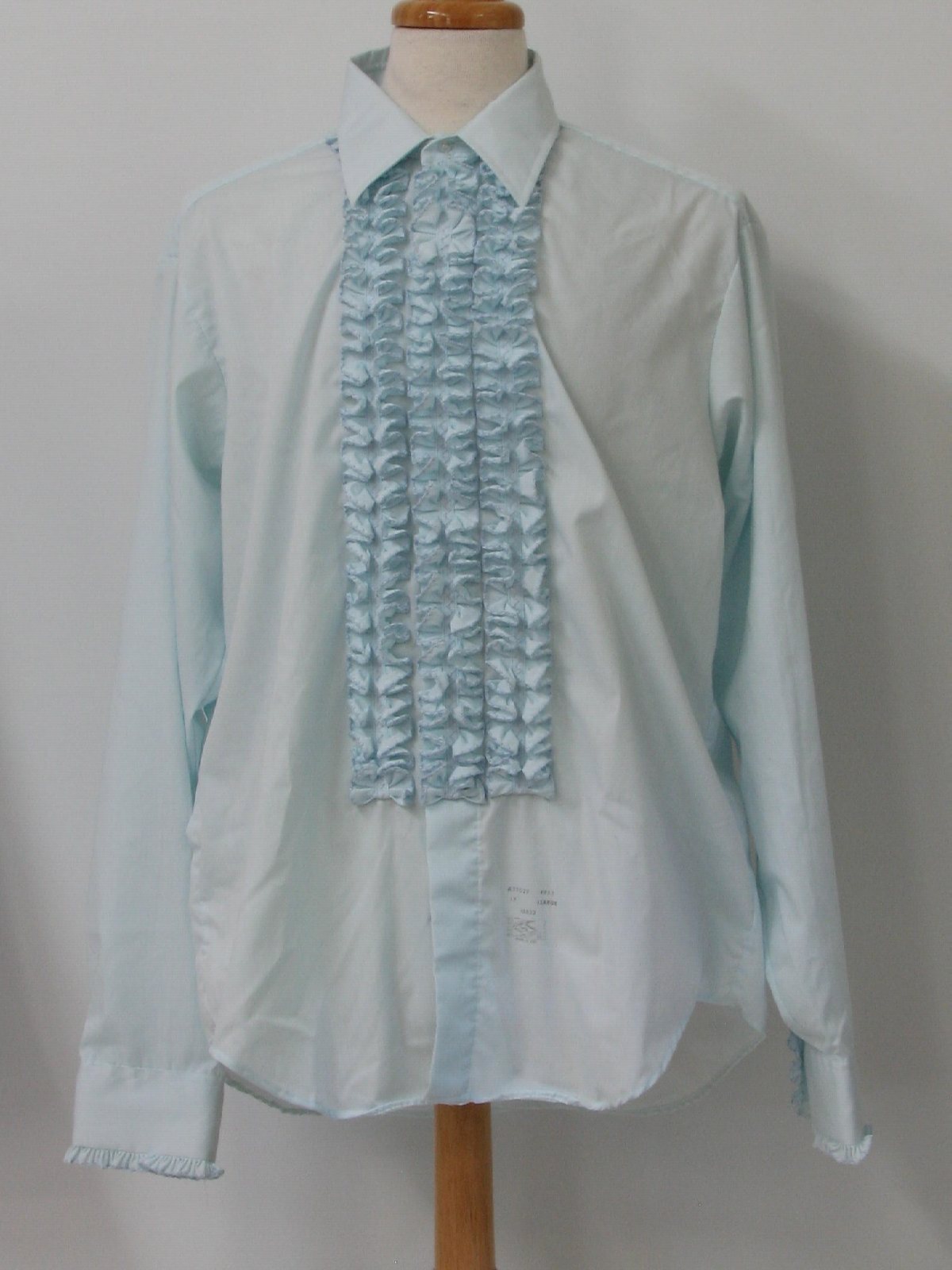 70s -Lion of Troy- Mens powder blue cotton and polyester blend longsleeve tuxedo shirt, with ruffled trim on the front and on the button cuffs.