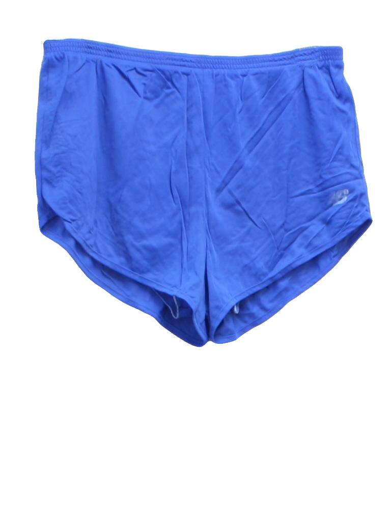 80s -New Balance- Mens blue background nylon on nylon, brief lined totally 80s running shorts with elastic waistline and notched side vent hems.