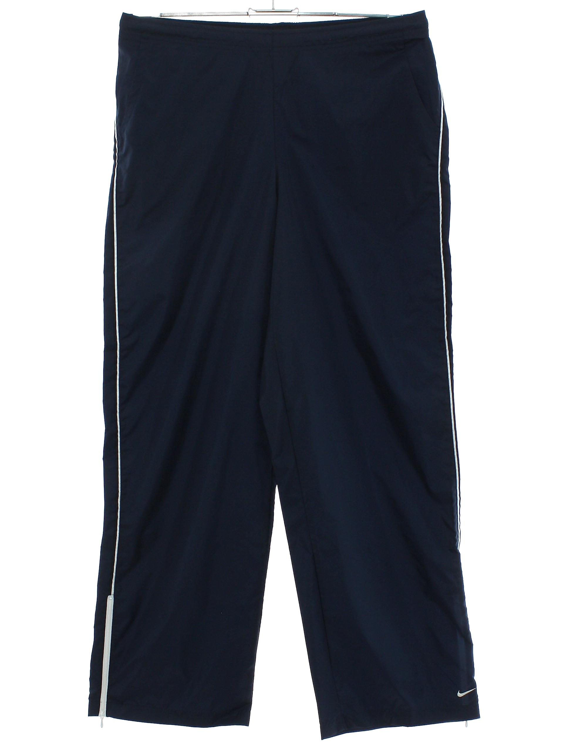 Pants: 90s (early 2000s) -Nike- Mens navy blue and white nylon taffeta wide  leg running pants with elasticized waist with drawstring, 2 side pocket and  zippered back pocket, short zippers at cuffs
