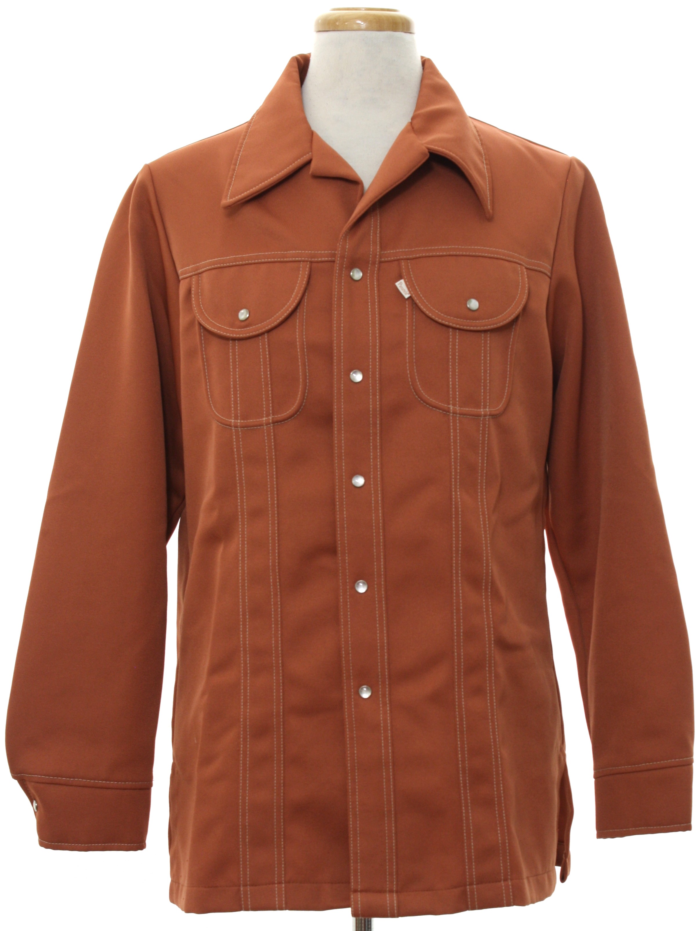 1970 s Vintage Levis Panatela Jacket 70s Levis Panatela Mens terra cotta orange background polyester doubleknit snap cuff longsleeve snap front leisure jacket. Jacket has white top stitching and pea...