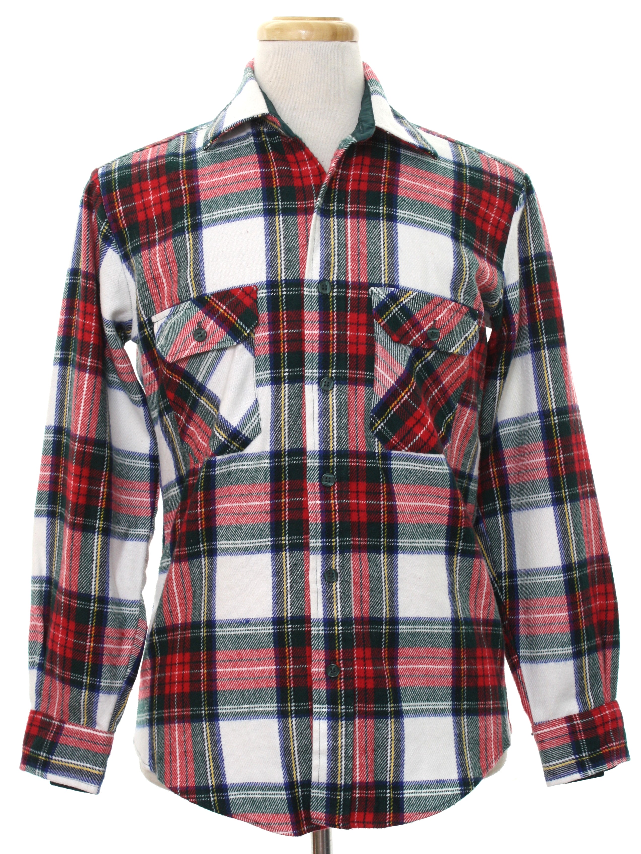 1980s Vintage Shirt 80s Ozark Trail Mens White background acrylic flannel button cuff longsleeve button up front flannel shirt with plaid pattern in shades of white red green yellow and blue. Fold