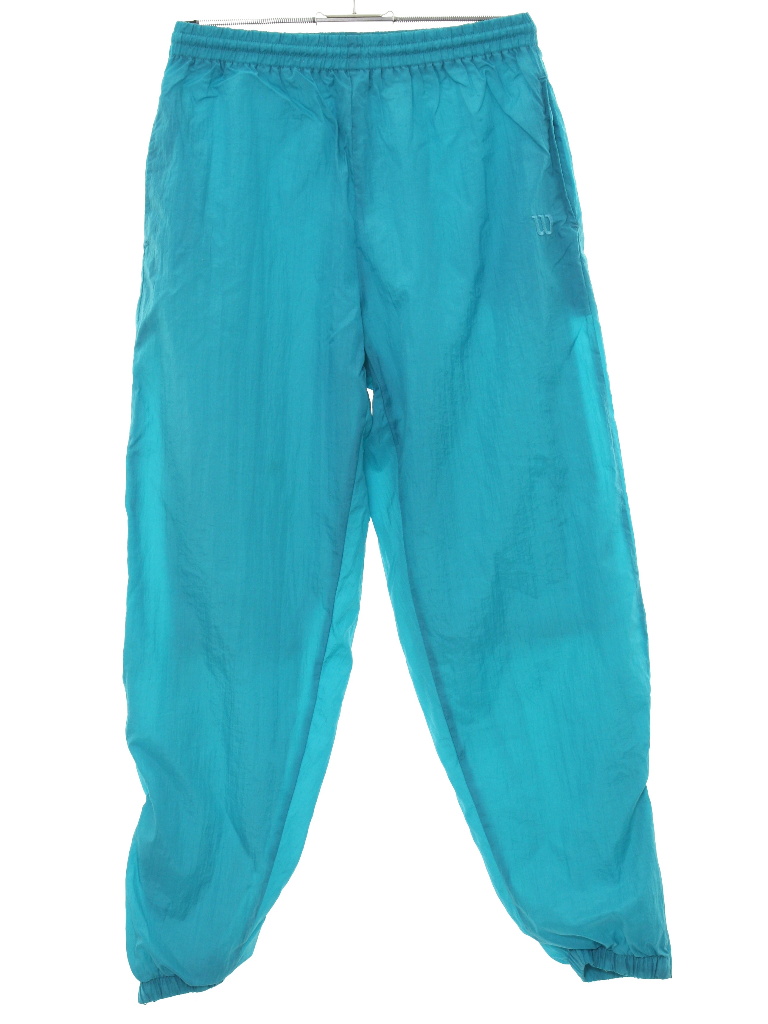 Retro Eighties Pants: 80s style (made in 90s) -Wilsons- Womens bright aqua  green solid colored nylon flat front, slightly tapered leg baggy track pants  with elastic cuff hem with ankle zipper, inset