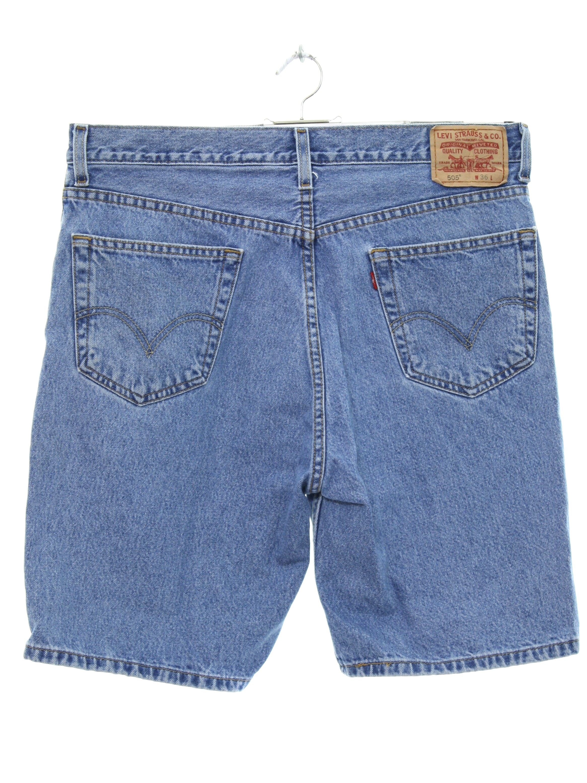 Levis 505 Nineties Vintage Shorts: Late 90s -Levis 505- Mens blue stonewash  background cotton grunge denim shorts. These jorts feature the classic 5  pocket style, red small e Levis tab, and paper