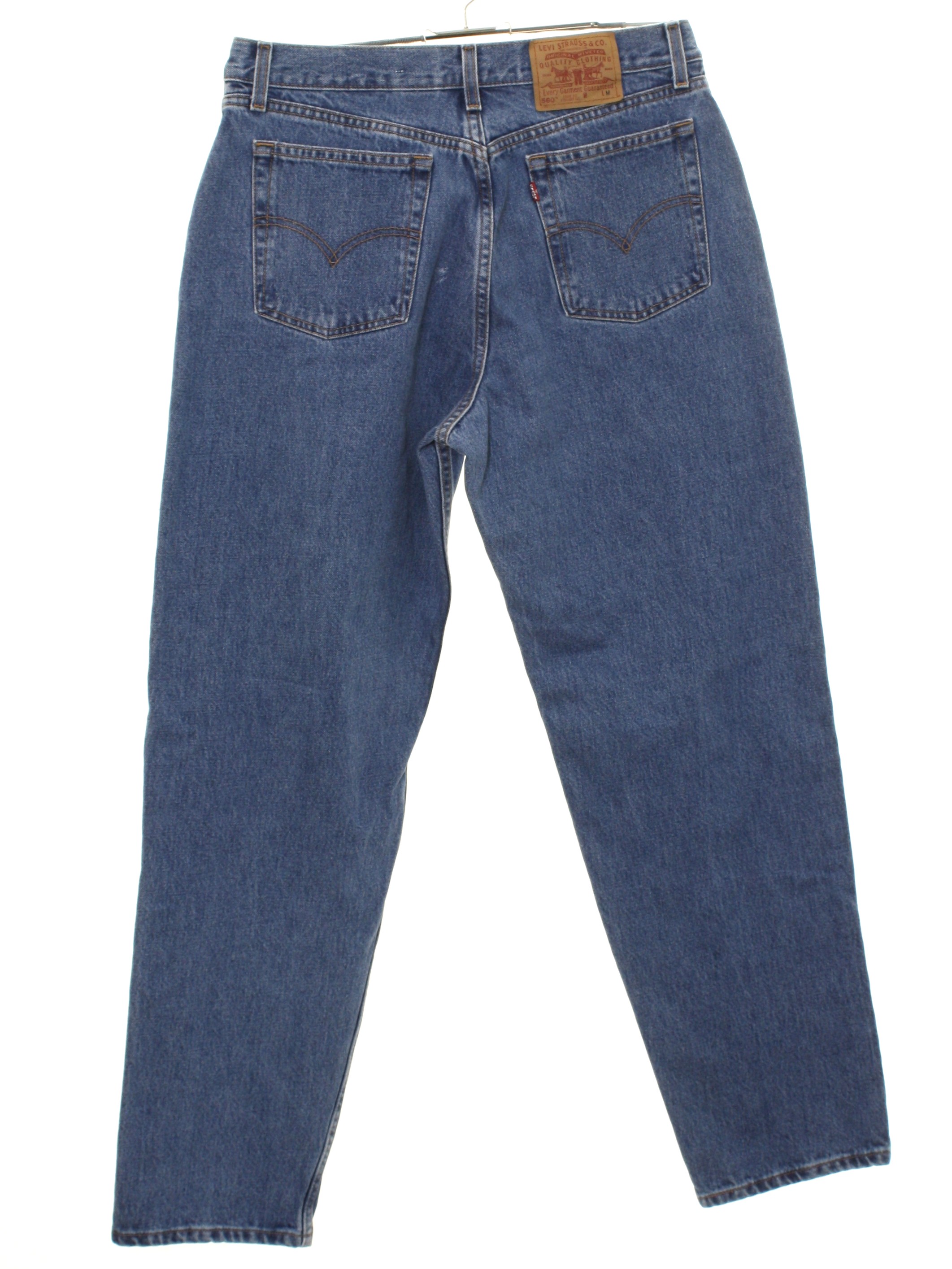 1990s Levis 560 Pants: 90s -Levis 560- Womens blue cotton denim levis 550  loose fit straight leg denim high waisted jeans pants with zipper fly  closure with button. Five pocket style -
