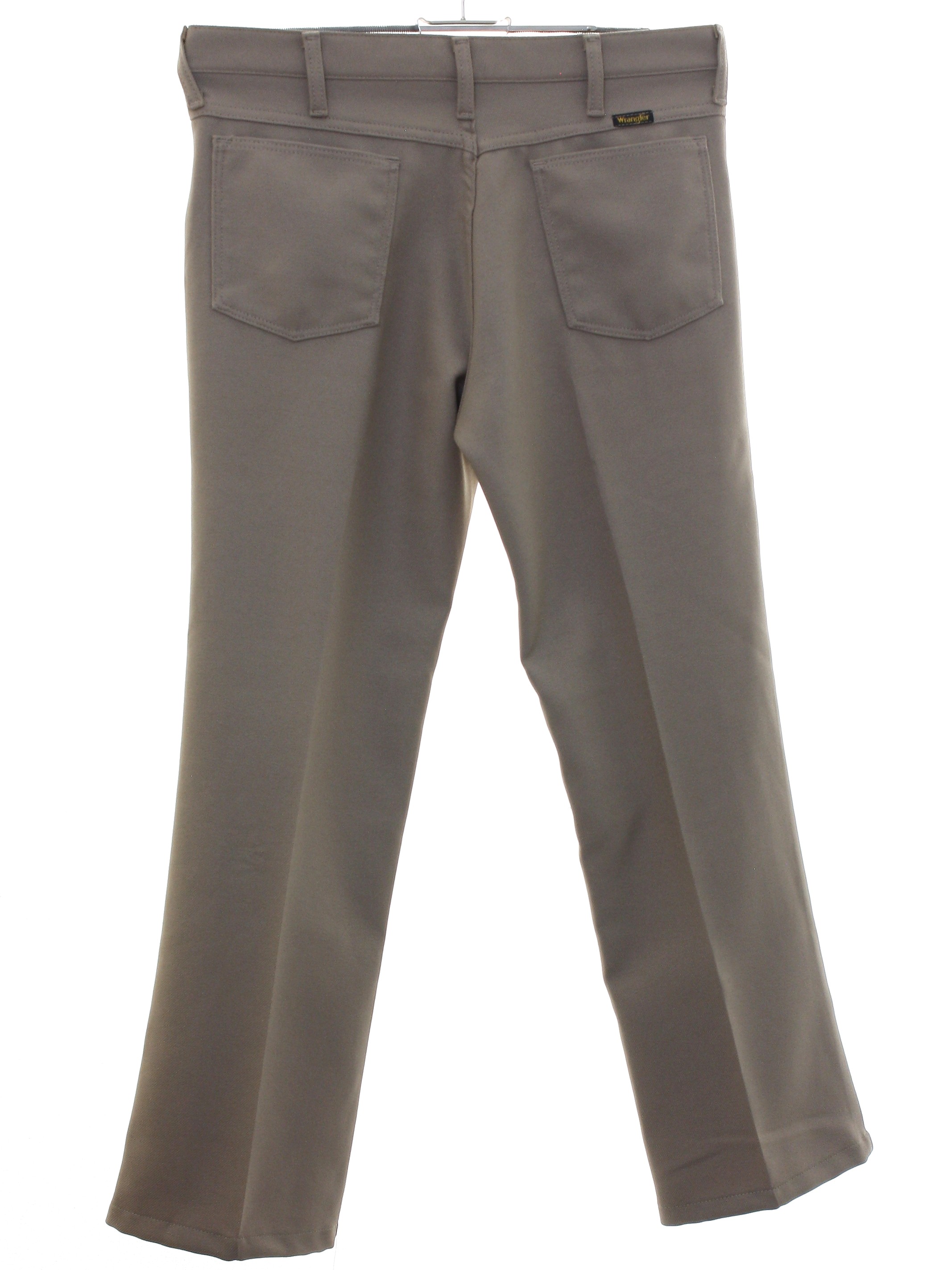 1970's Pants (Wrangler): 70s -Wrangler- Mens tan solid colored polyester  flat front jeans-cut pants with cuffless hem, front scoop pockets, two rear  patch pockets, button and zippered front closure, 2 1/2 inch