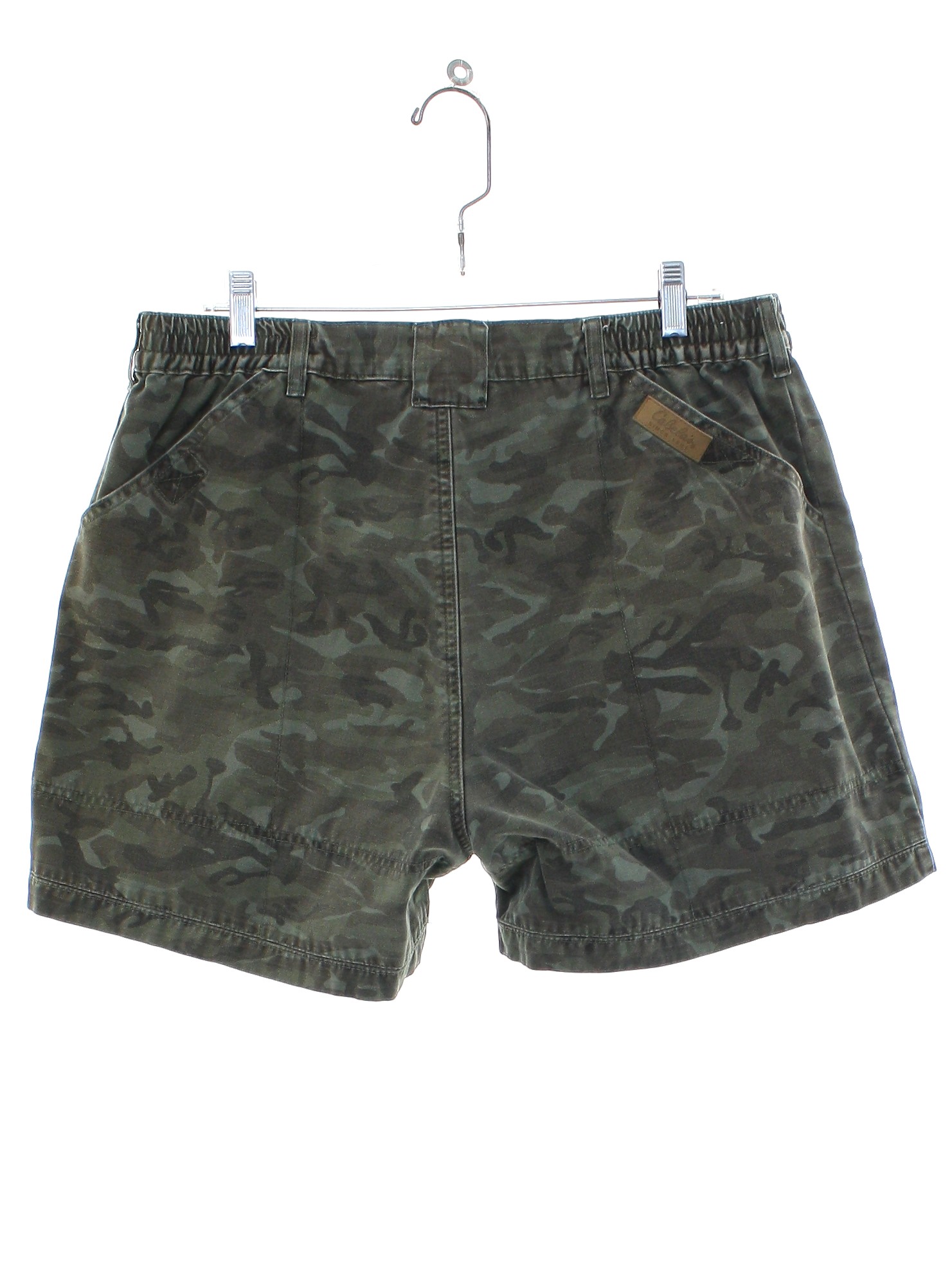 Vintage 90s Shorts 90s Cabelas Mens olive green background with olive drab and browns camoflage print six pocket cargo shorts with front metal button and zipper fly closure elasticized side waist gu...