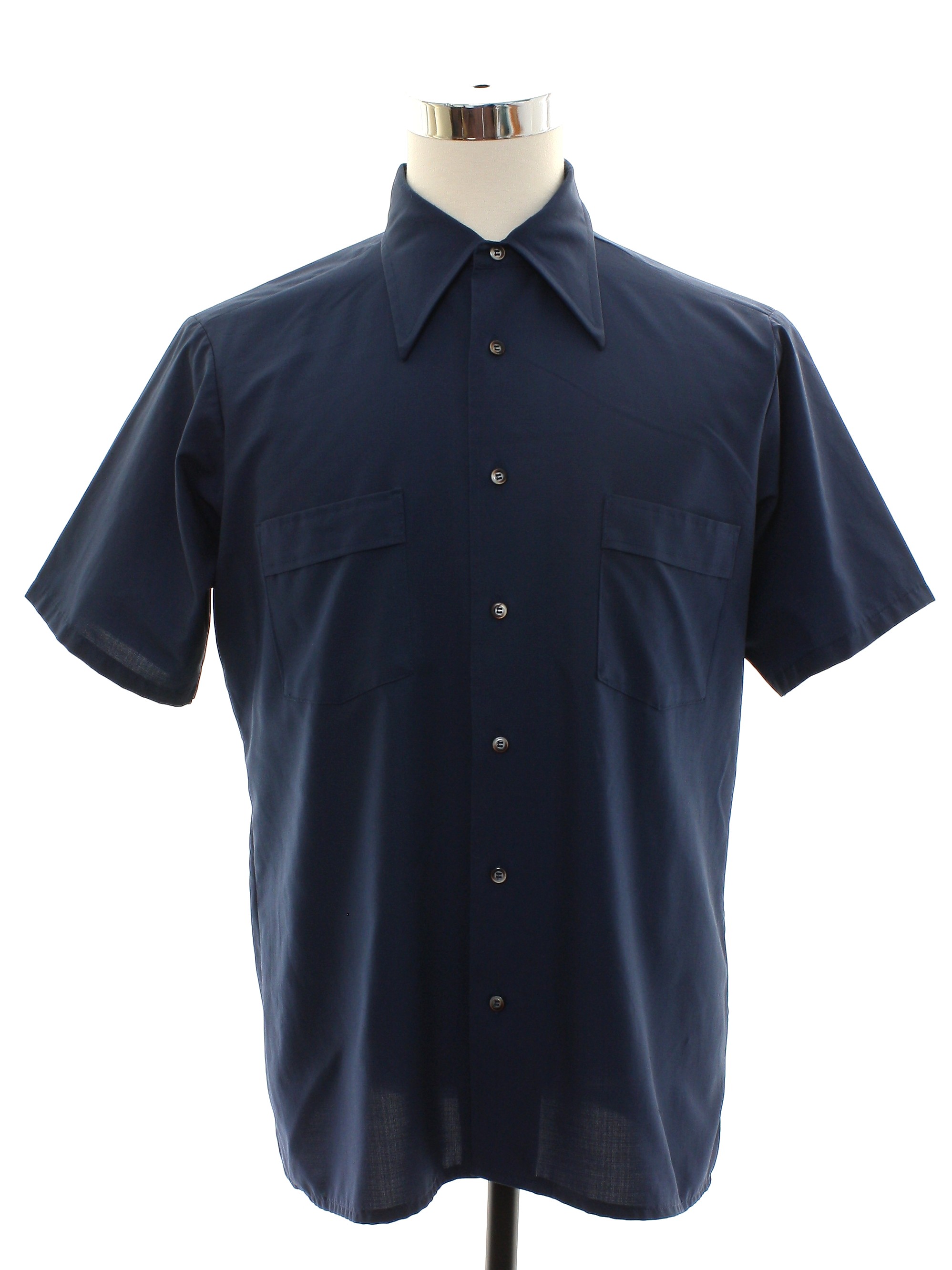 70 s Van Heusen Super Silk Shirt Early 70s Van Heusen Super Silk Mens navy blue woven Qiana nylon short sleeve button up front mod sport shirt. Solid color silky texture and slightly
