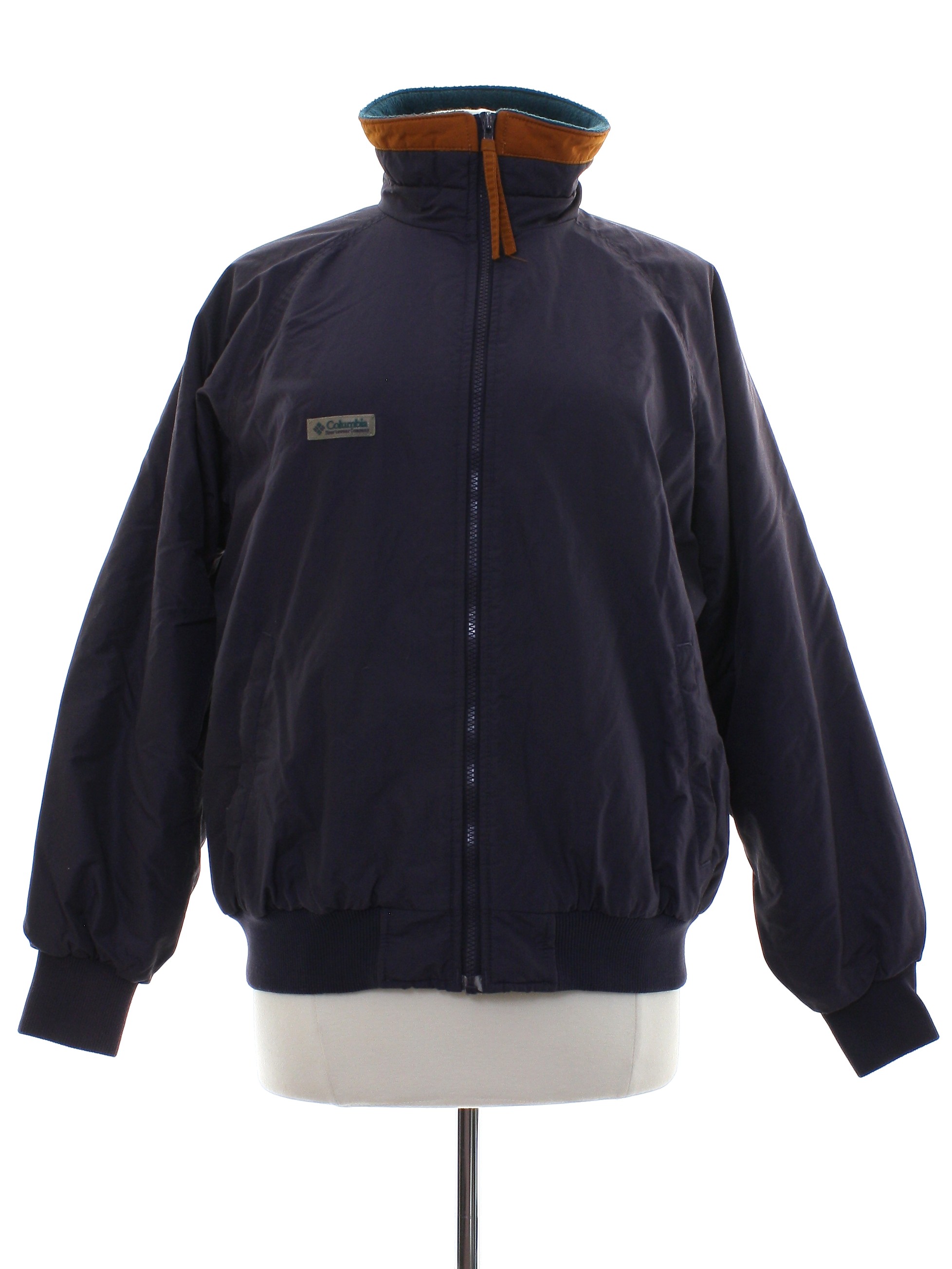 Nineties Vintage Jacket 90s Columbia Sportswear Womens raisin nylon dolman longsleeve zip front ski jacket with polyester filling. Solid color with tan banded trim on the collar and zipper pull plus...