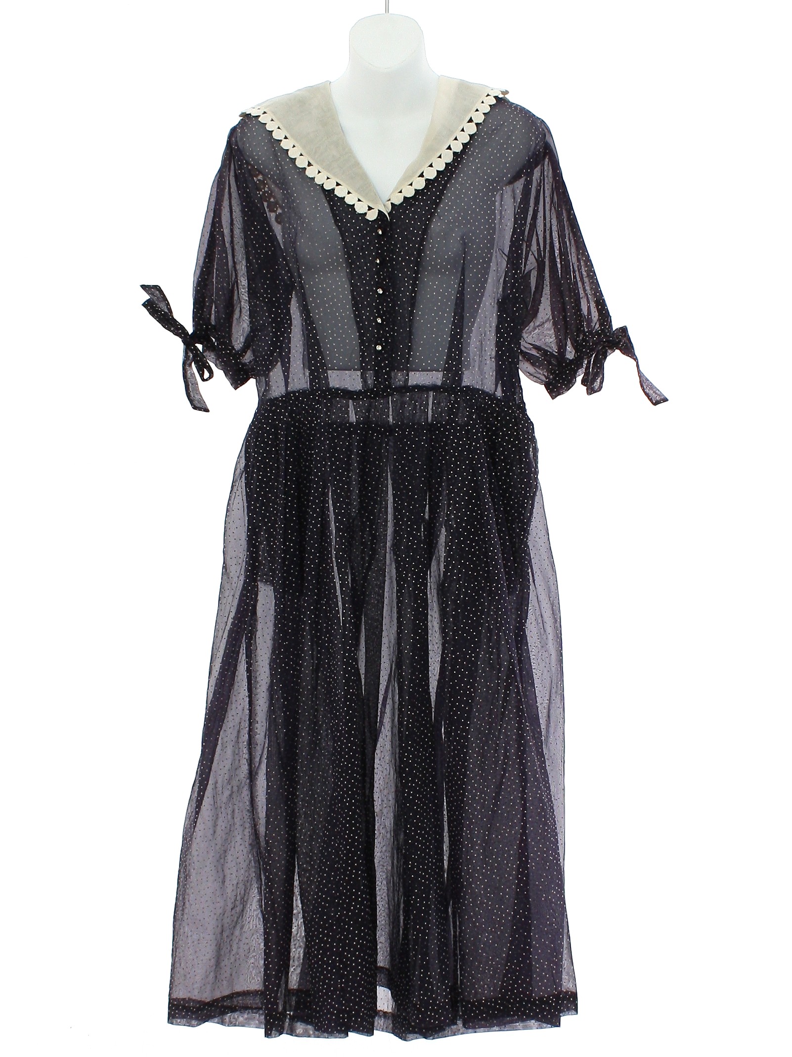 60s Dress Kay Windsor 60s Kay Windsor Womens navy and white semi sheer dotted swiss dress having short sleeves that gather into a narrow band and have tie extensions providing eye appeal. There