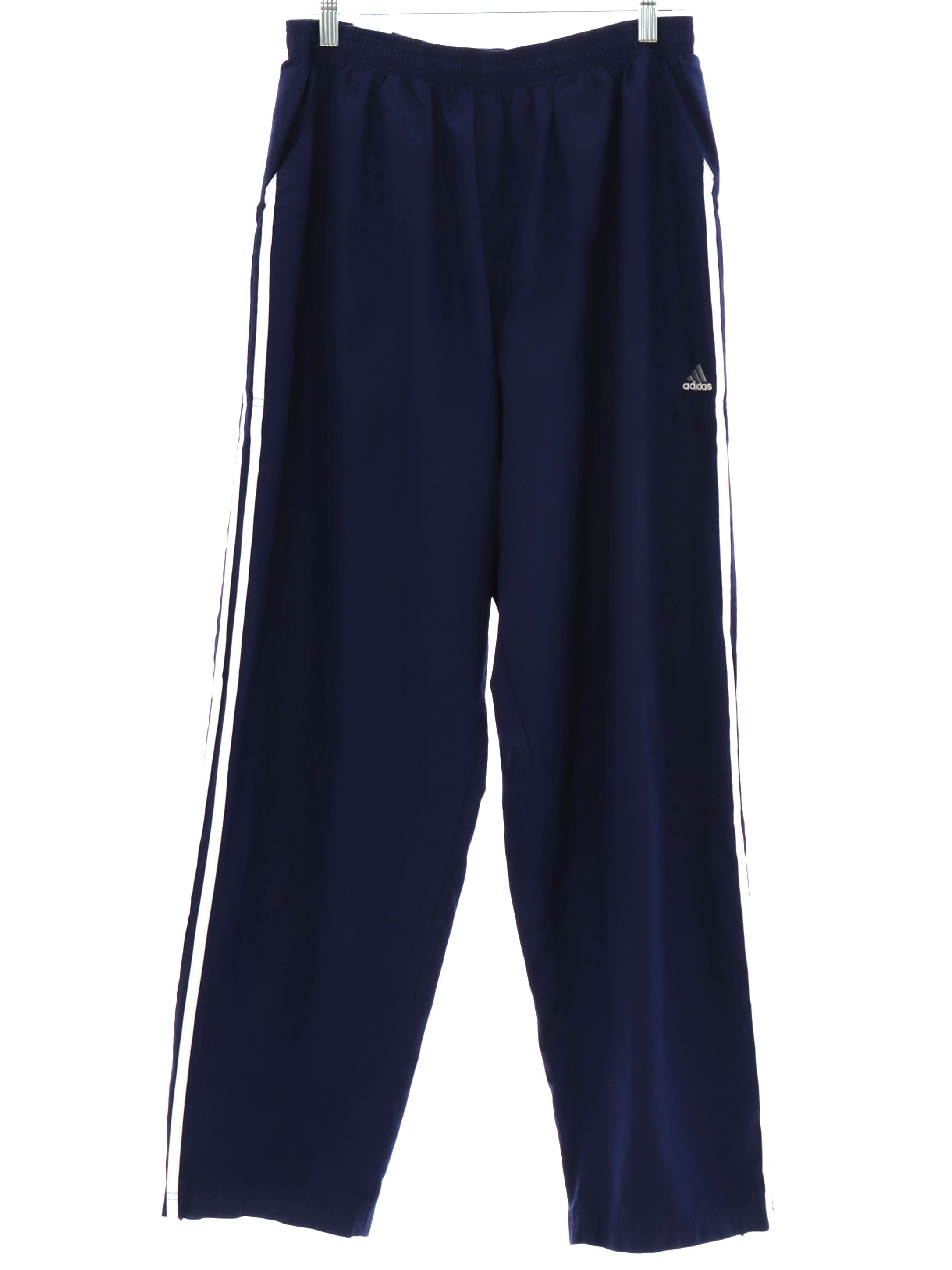 Pants: 90s -Adidas- Unisex midnight blue nylon shell track pants with  cuffless hem, front slant side entry pockets, one rear inset pocket with  velcro closure, elastic waistline, nylon mesh lining. Slightly tapered