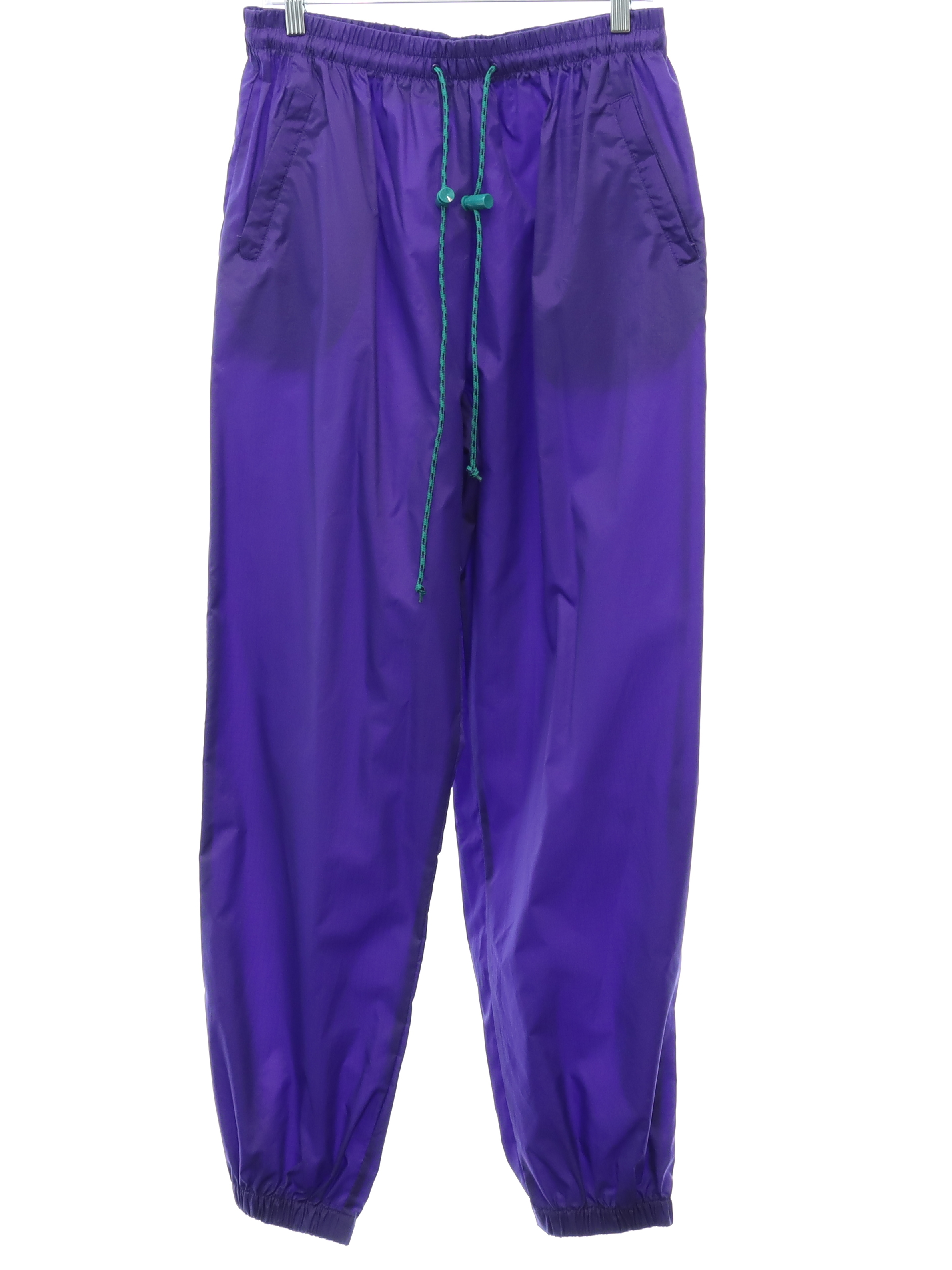 Vintage 1980's Pants: 80s style (made in 90s) -Northern Reflections- Womens  purple solid colored nylon shell flat front track or jogging pants with  elastic cuff hem, tapered legs, elastic waistline with outside