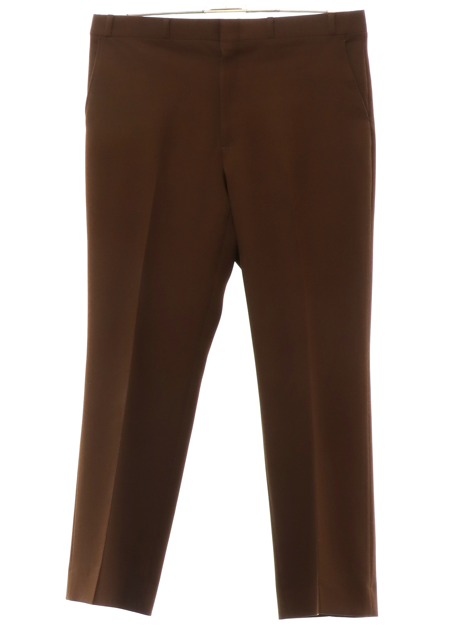 Champion 1980s Vintage Pants 80s Champion Mens cocoa brown solid colored polyester flat front slacks pants. Cuffless hem vertical seam inset side entry front pockets one rear inset open pocket and o...