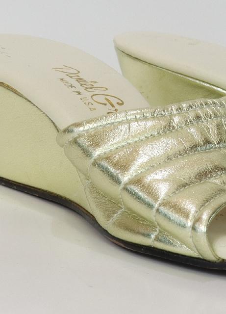 Daniel Green USA 1960s Vintage Shoes 60s Daniel Green USA Womens metallic gold vinyl classic cocktail style slippers. Stitched design above the open toes 2 inch wedge heel. Minor spots on the
